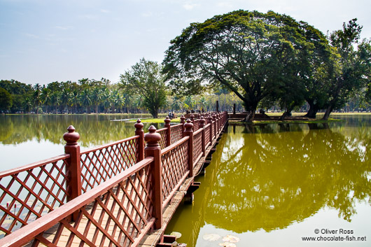 Lake with bridge and island at the Sukhothai temple complex