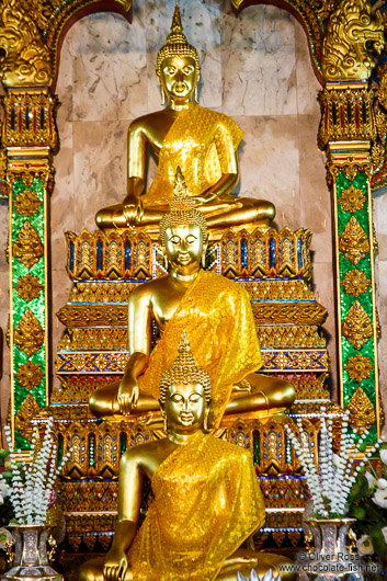 Row of Buddha statues at a temple in Bangkok