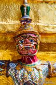 Travel photography:Golden demon sculpture at Wat Phra Kaew, the Bangkok Royal Palace, Thailand
