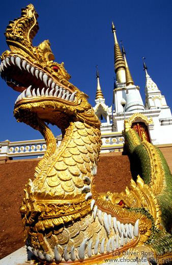Dragon-eat-dragon figure at a temple in Chiang Rai province