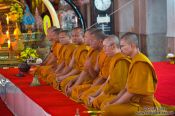Travel photography:Monks assembled for prayer at Bangkok´s Wat Chana Songkram, Thailand