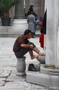Travel photography:Ritual cleansing before the Friday prayer outside Yeni Mosque in Istanbul, Turkey