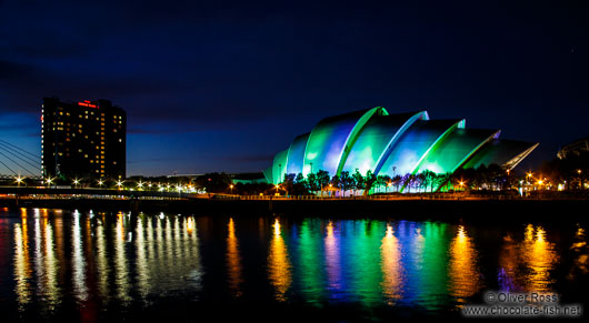 The Glasgow Clyde Auditorium with Bell`s Bridge illuminated by night