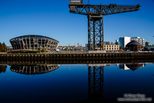 Glasgow River Clyde with disused dock crane and stadium
