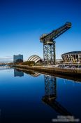 Travel photography:The Clyde River with Auditorium and disused dock crane, United Kingdom