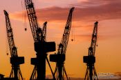 Travel photography:Glasgow Dock Cranes at sunset, United Kingdom
