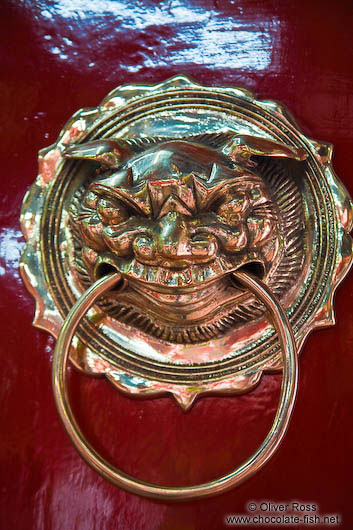 Brass door knob at a Chinese assembly hall in Hoi An