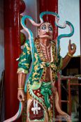 Travel photography:Figure at a Hoi An Chinese assembly hall , Vietnam