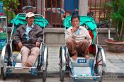 Travel photography:Hoi An ricksha drivers waiting for customers, Vietnam