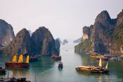 Travel photography:Junk ships cruising through Halong Bay , Vietnam