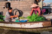 Travel photography:Selling vegetables at the Can Tho floating market , Vietnam