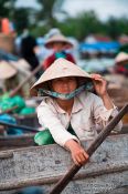 Travel photography:Woman at the Can Tho floating market , Vietnam