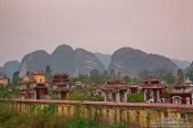 Travel photography:Graves with characteristic karst mountains near Ninh Binh, Vietnam