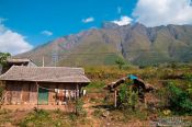 Travel photography:Houses near Sapa with Fansipan mountain in the background, Vietnam
