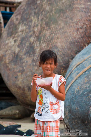 Girl with rice bowl in Mui Ne 